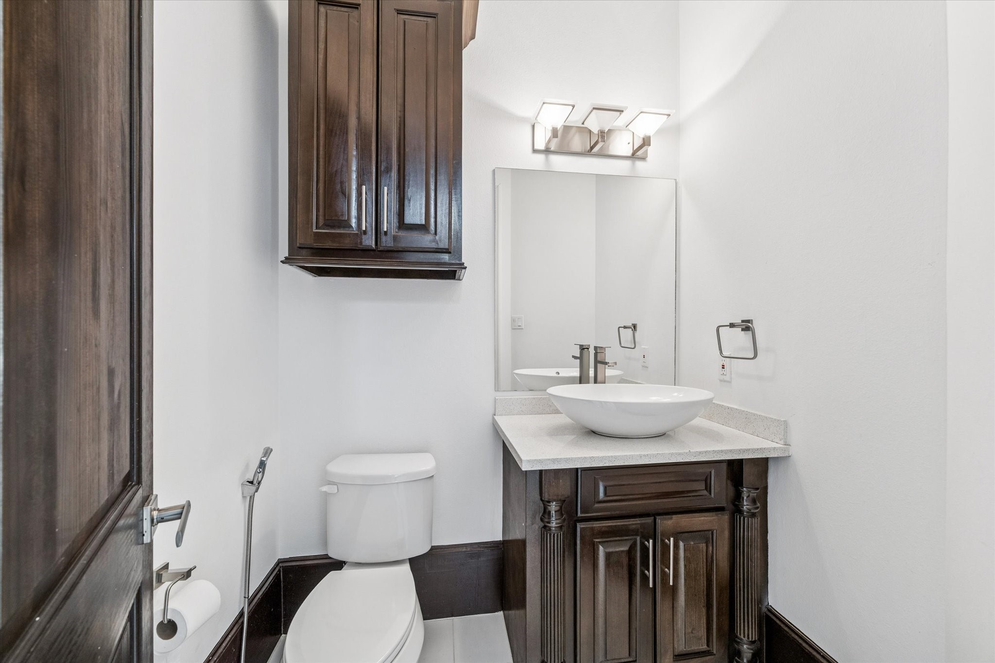 3942 Charleston Street Houston, TX 77021 - Photo 12 of 34 a bathroom with a sink a toilet and mirror