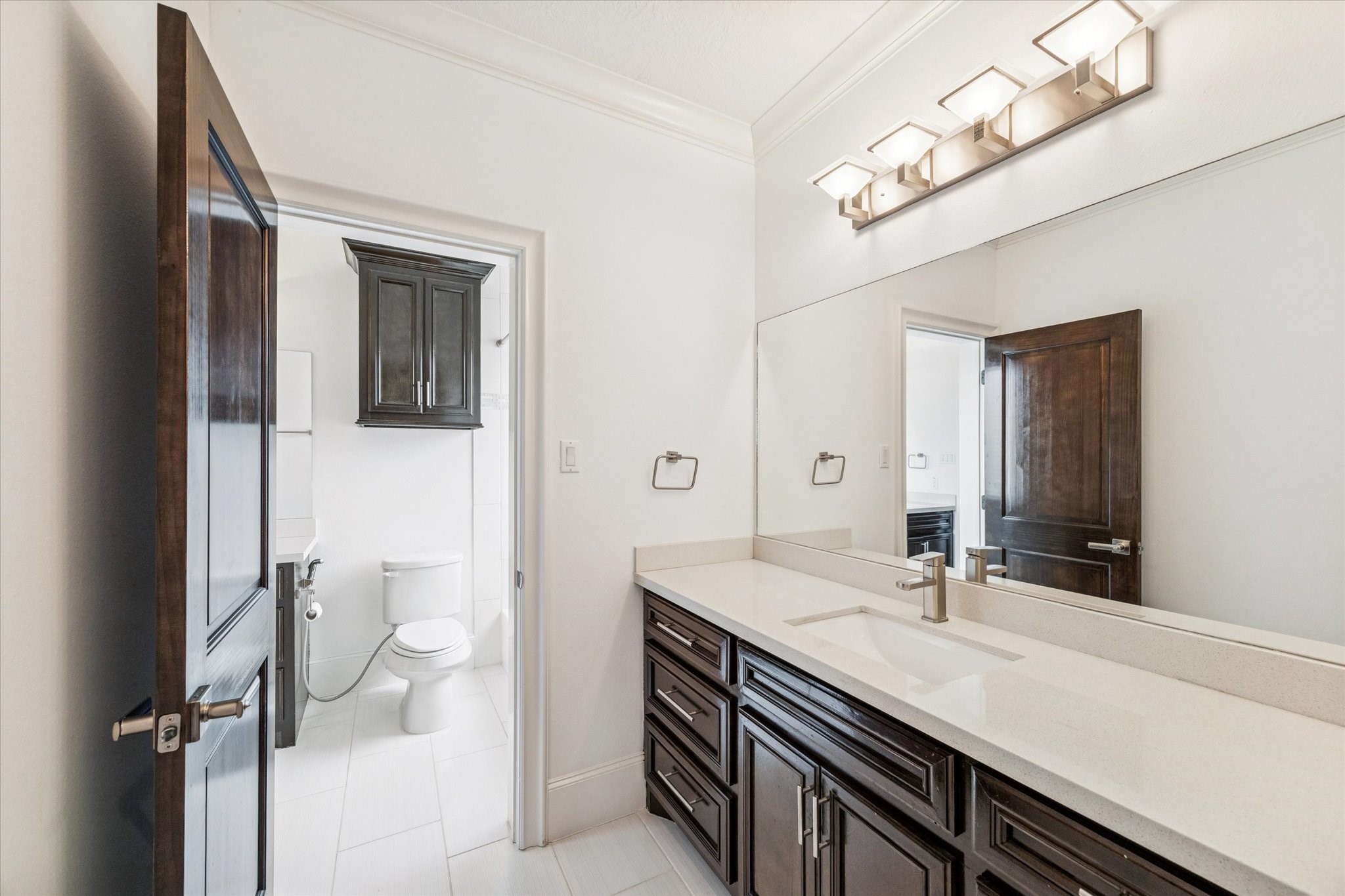 3942 Charleston Street Houston, TX 77021 - Photo 23 of 34 a bathroom with a sink a toilet and a mirror