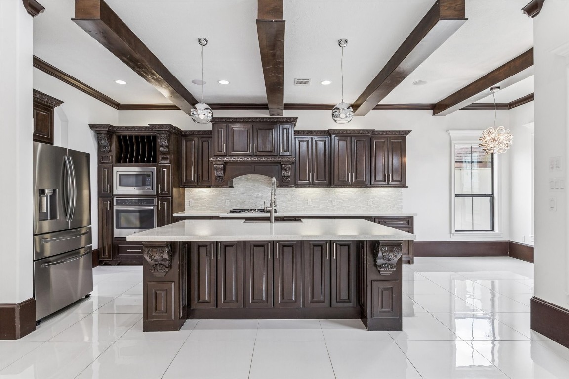 3942 Charleston Street Houston, TX 77021 - Photo 9 of 34 a kitchen with a refrigerator and countertop