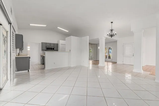 a view of a kitchen with a sink and cabinets