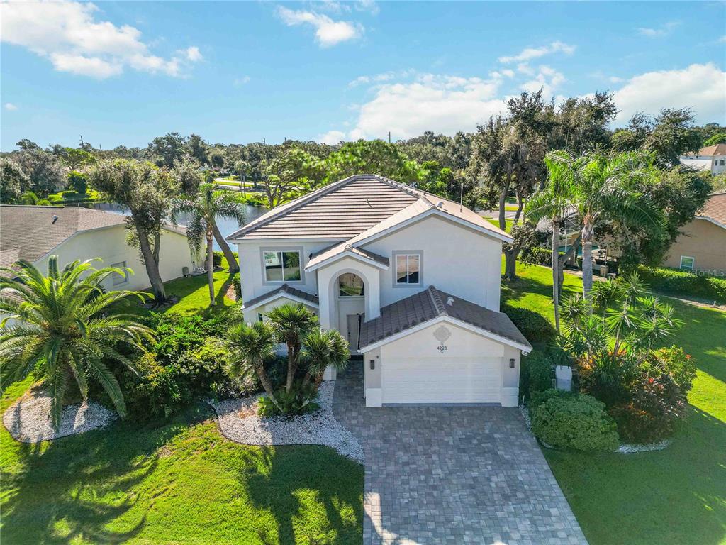 4223 Balmoral Way Sarasota, FL 34238 - Photo 1 of 72 a aerial view of a house with a yard and potted plants