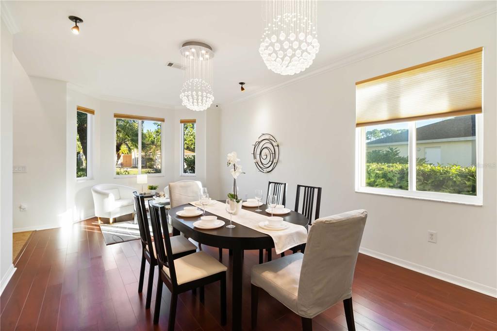 4223 Balmoral Way Sarasota, FL 34238 - Photo 16 of 72 a view of a dining room with furniture window and wooden floor