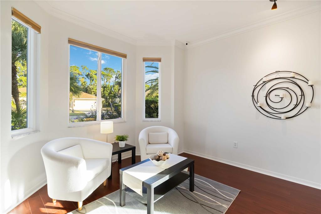 4223 Balmoral Way Sarasota, FL 34238 - Photo 18 of 72 a living room with furniture and a window