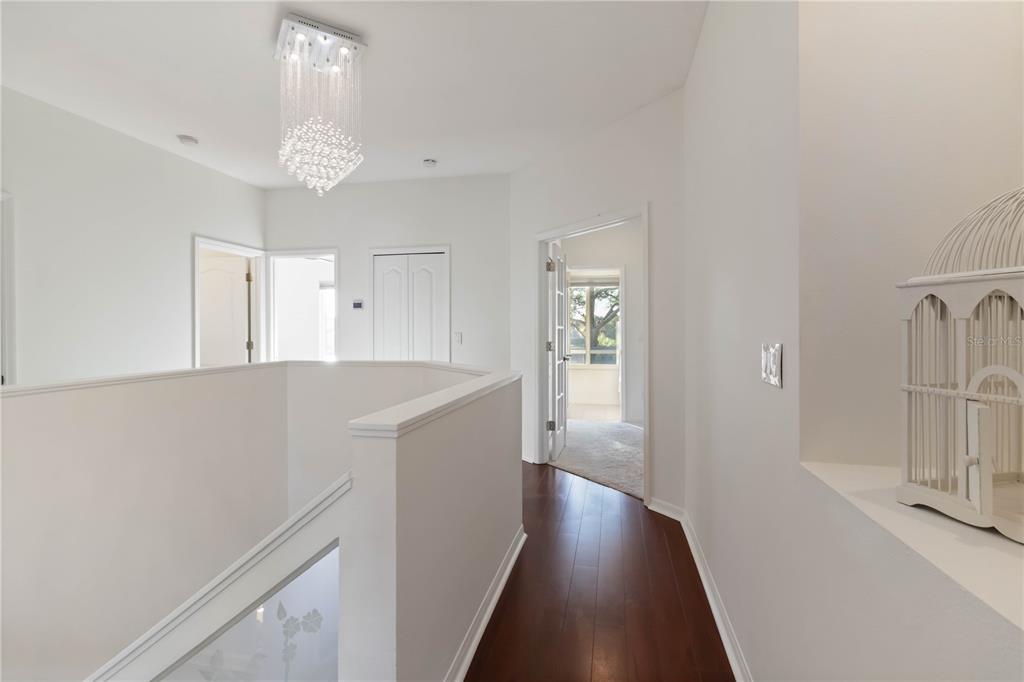 4223 Balmoral Way Sarasota, FL 34238 - Photo 22 of 72 a view of a room with wooden floor and a window