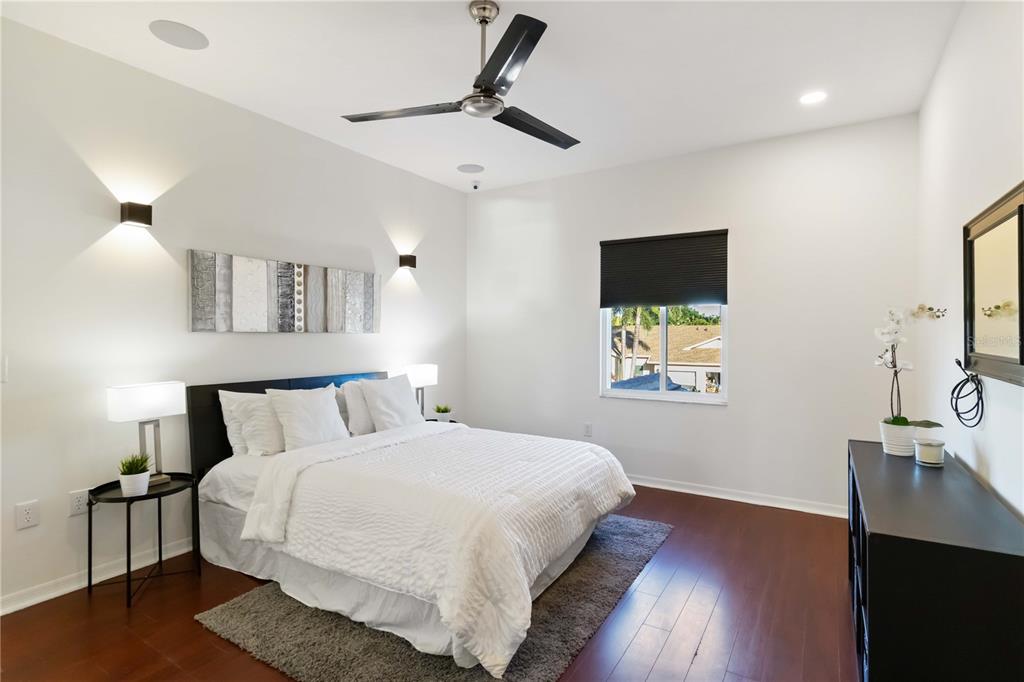 4223 Balmoral Way Sarasota, FL 34238 - Photo 23 of 72 a bedroom with a bed and a flat tv screen on the dresser