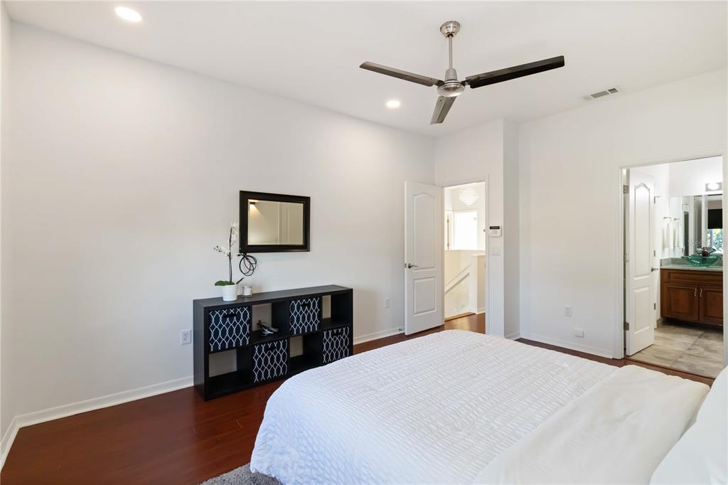 4223 Balmoral Way Sarasota, FL 34238 - Photo 24 of 72 a bedroom with a bed and a table in it