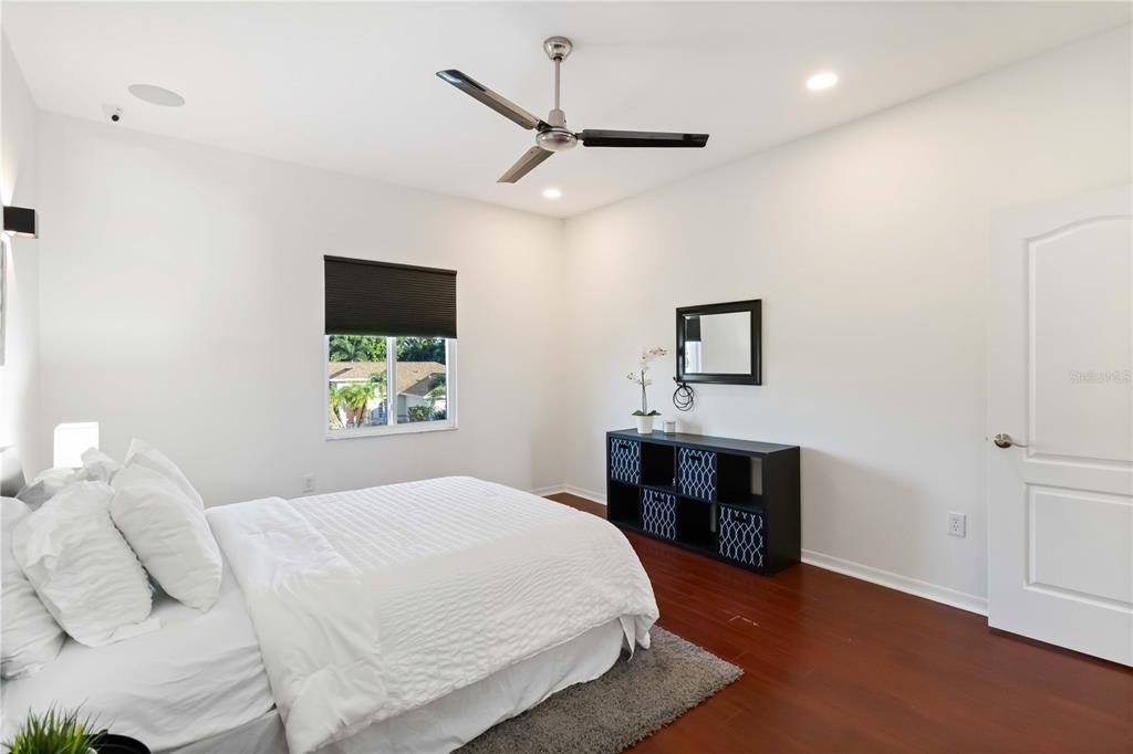 4223 Balmoral Way Sarasota, FL 34238 - Photo 25 of 72 a bedroom with a bed and a flat screen tv