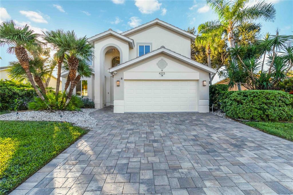 4223 Balmoral Way Sarasota, FL 34238 - Photo 3 of 72 a front view of house with yard and trees