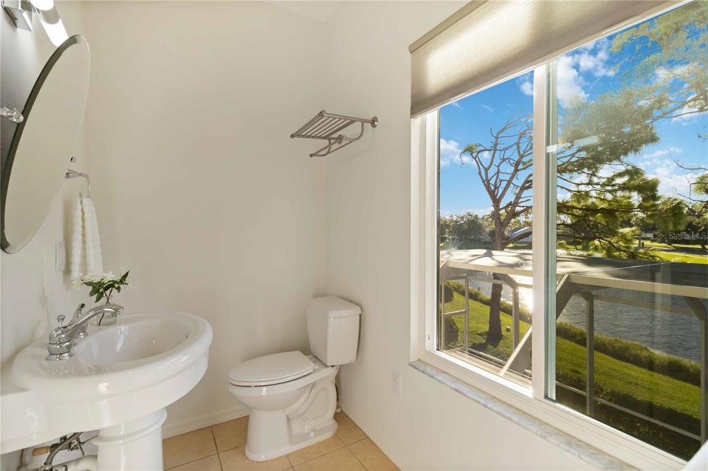 4223 Balmoral Way Sarasota, FL 34238 - Photo 31 of 72 a bathroom with a sink and a mirror