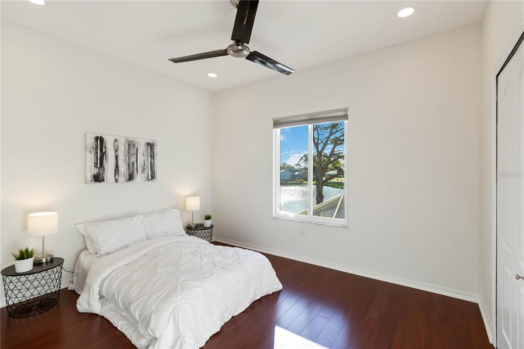 4223 Balmoral Way Sarasota, FL 34238 - Photo 32 of 72 a bedroom with a bed and a window