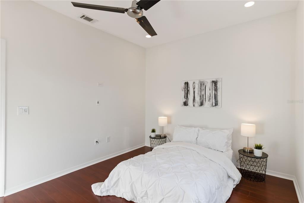 4223 Balmoral Way Sarasota, FL 34238 - Photo 33 of 72 a bedroom with a bed and a night stand