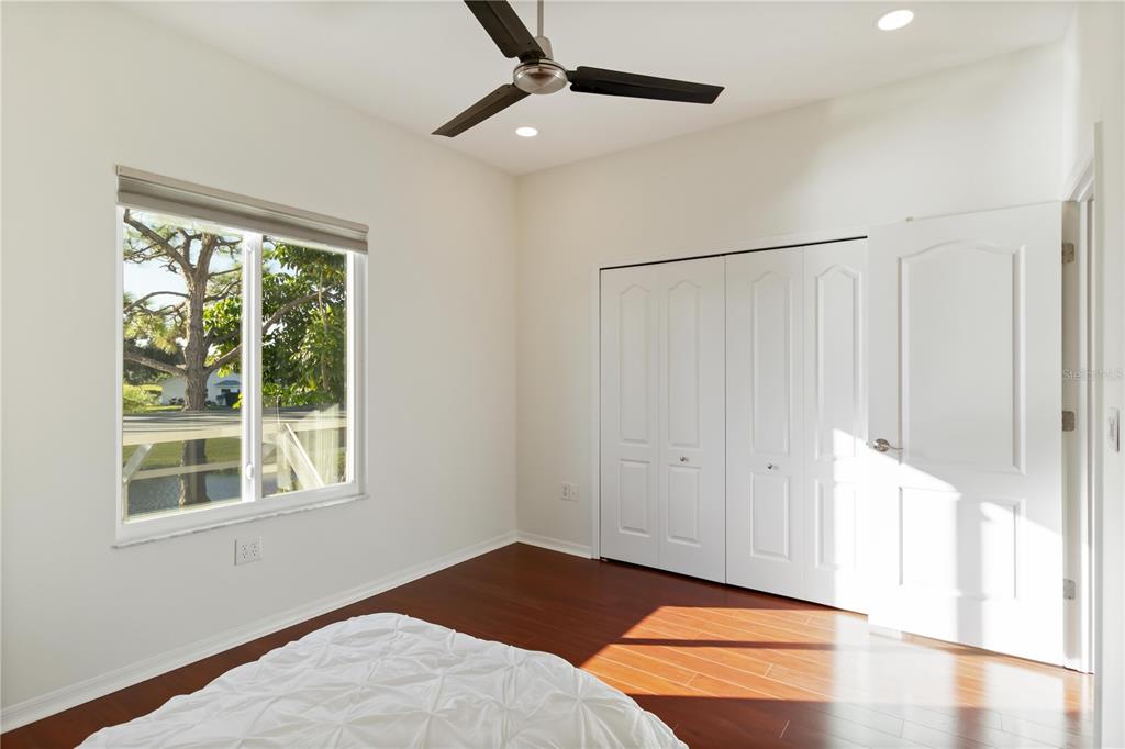 4223 Balmoral Way Sarasota, FL 34238 - Photo 34 of 72 a view of an empty room with window and wooden floor