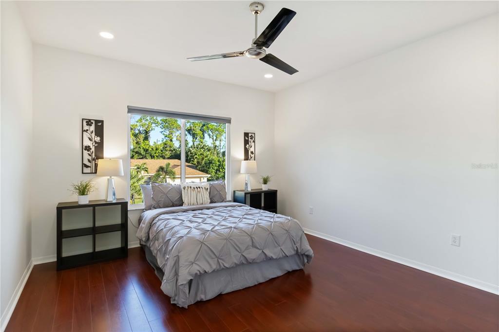 4223 Balmoral Way Sarasota, FL 34238 - Photo 37 of 72 a bedroom with a bed and a window