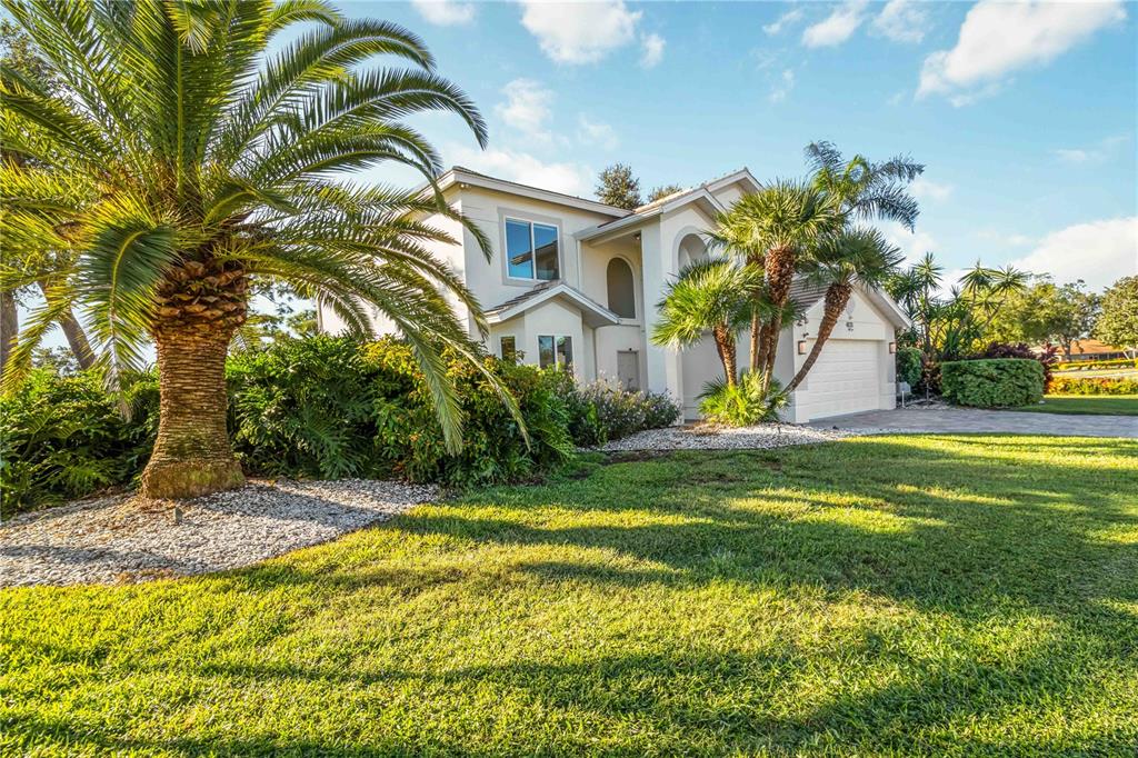 4223 Balmoral Way Sarasota, FL 34238 - Photo 4 of 72 a view of swimming pool with a garden and plants