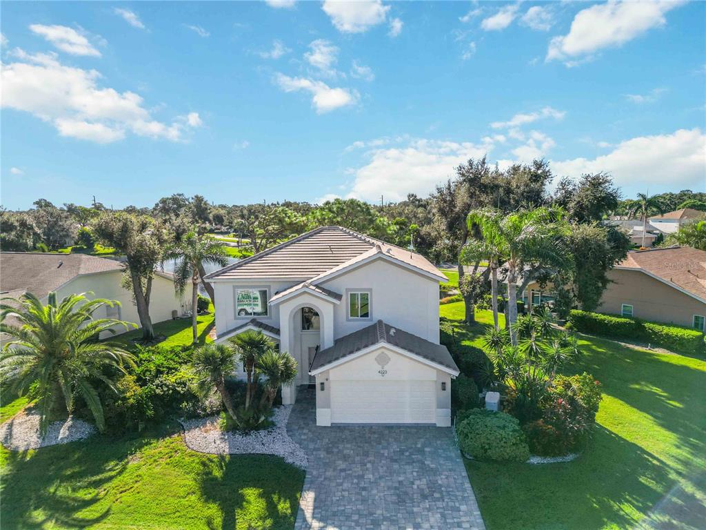 4223 Balmoral Way Sarasota, FL 34238 - Photo 52 of 72 a view of a garden with mountains in the background