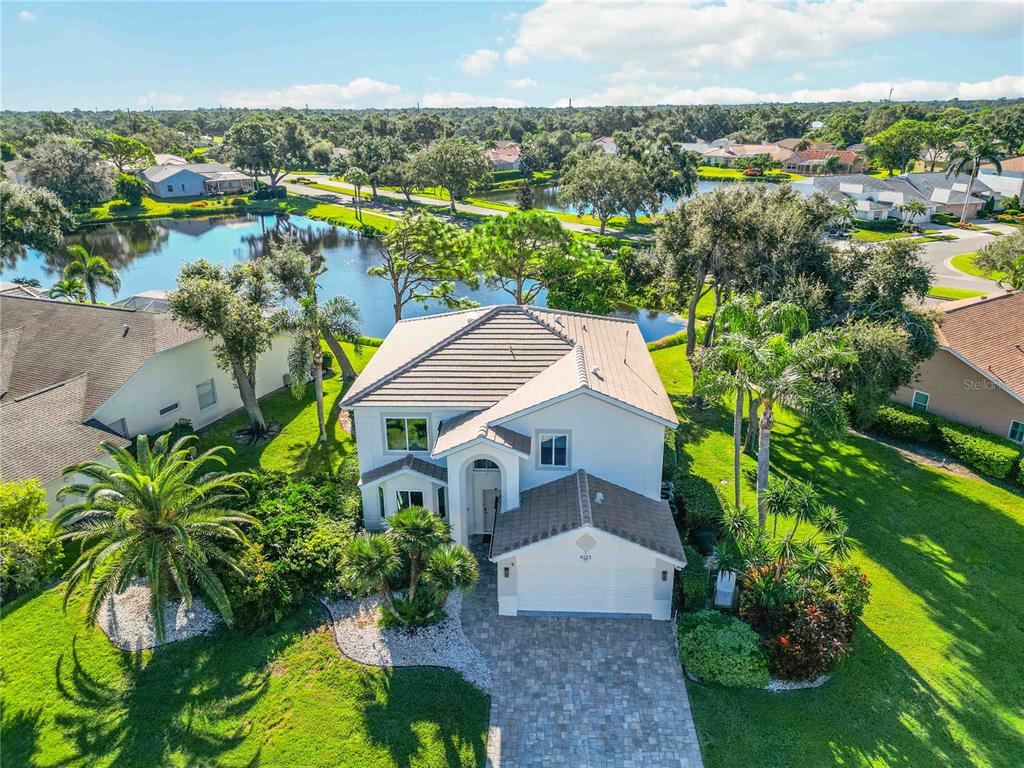 4223 Balmoral Way Sarasota, FL 34238 - Photo 56 of 72 a aerial view of a house with a garden and lake view