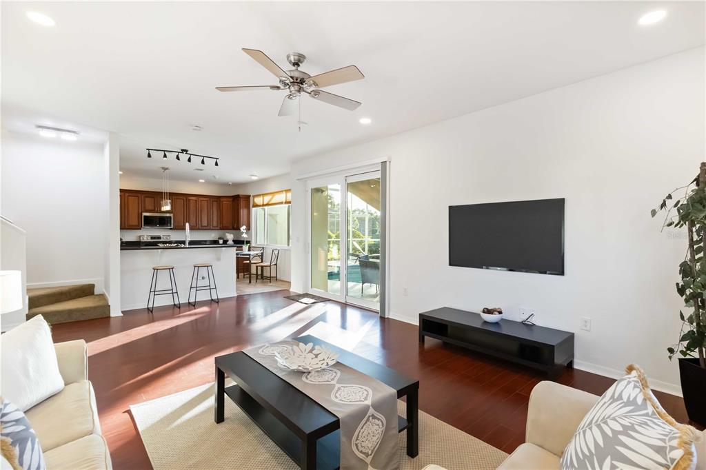 4223 Balmoral Way Sarasota, FL 34238 - Photo 9 of 72 a living room with furniture and a flat screen tv