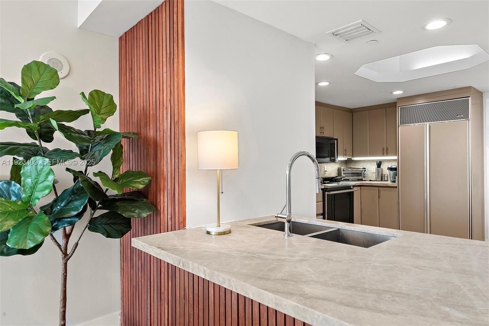 9595 Collins Avenue, Unit N10F Surfside, FL 33154 - Photo 13 of 49 a bedroom with a bed dresser and a potted plant