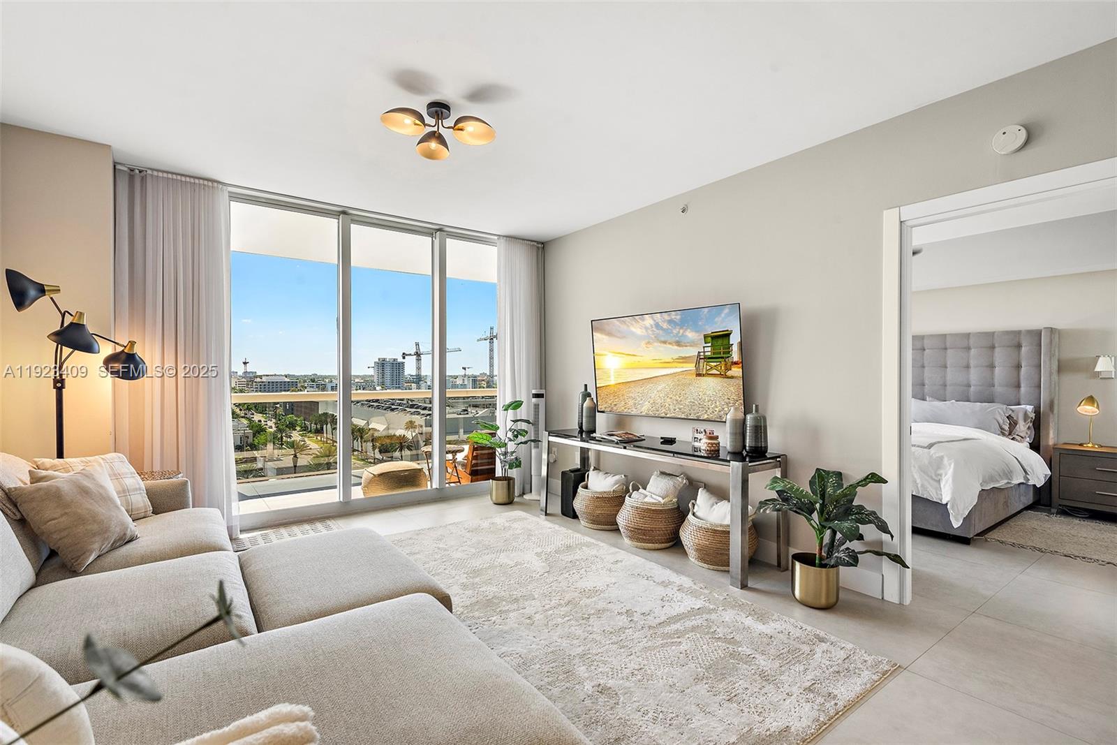 9595 Collins Avenue, Unit N10F Surfside, FL 33154 - Photo 8 of 49 a living room with furniture and large windows