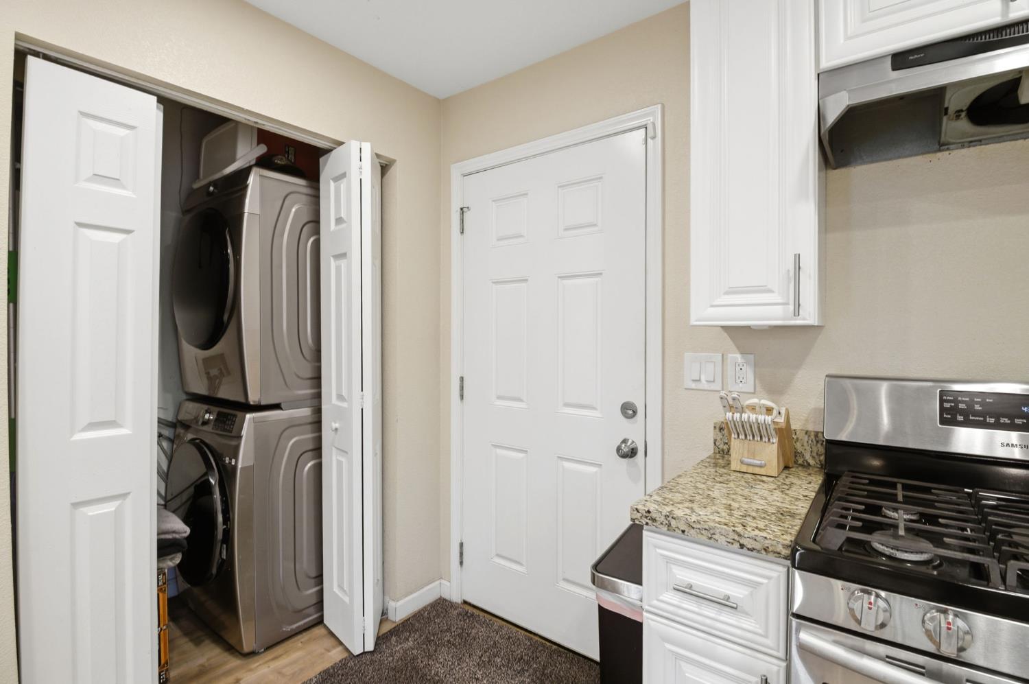 243 Angelus Street Turlock, CA 95380 - Photo 13 of 26 a kitchen with a refrigerator and a stove top oven