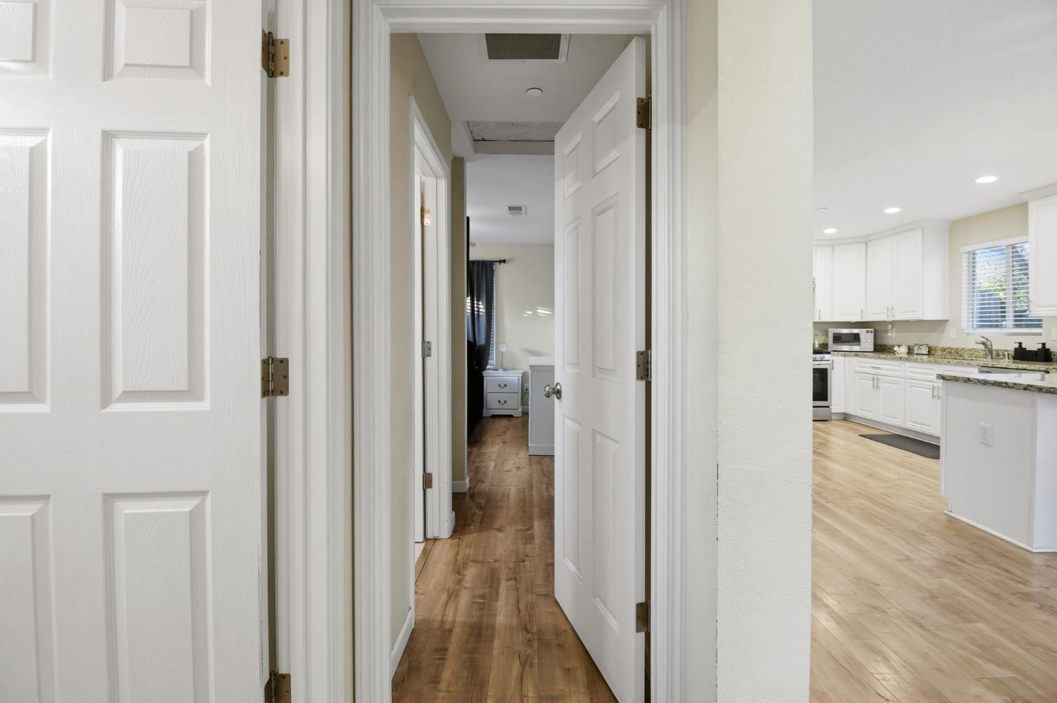 243 Angelus Street Turlock, CA 95380 - Photo 14 of 26 a view of a kitchen from the hallway