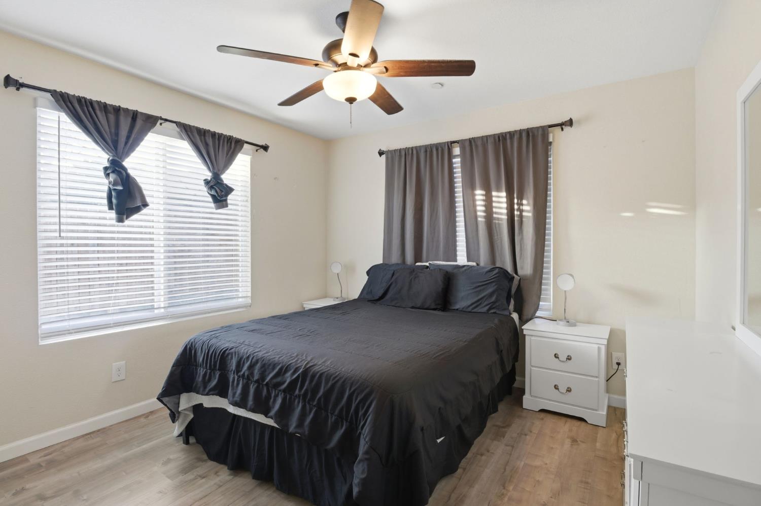 243 Angelus Street Turlock, CA 95380 - Photo 16 of 26 a bedroom with a bed and a window