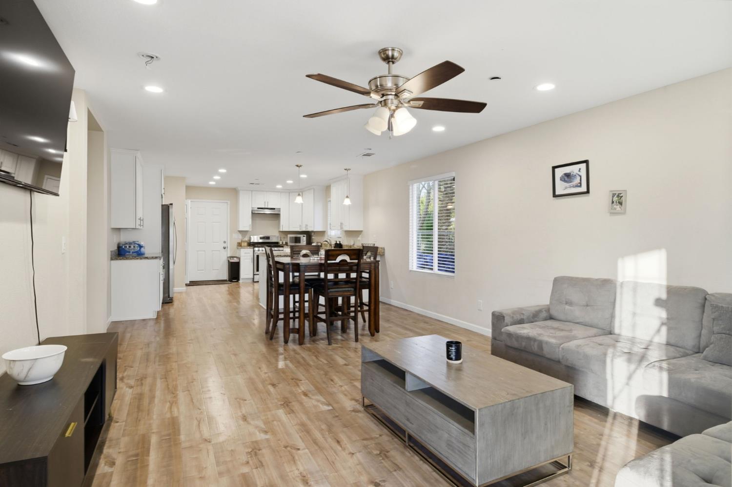 243 Angelus Street Turlock, CA 95380 - Photo 4 of 26 a living room with furniture and kitchen view