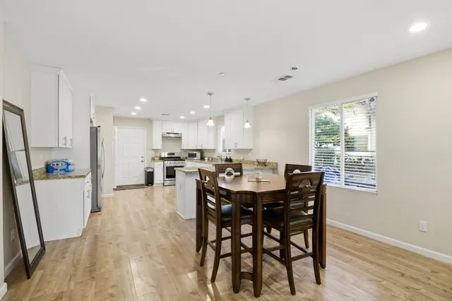 a dining room with furniture and window