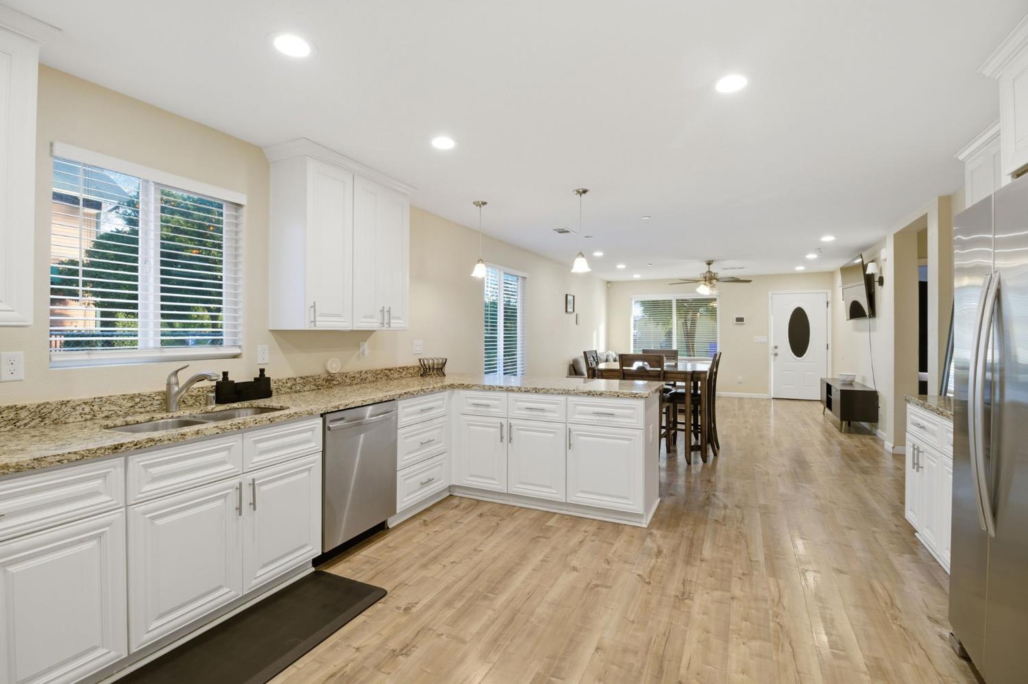 243 Angelus Street Turlock, CA 95380 - Photo 9 of 26 a kitchen with a sink microwave and cabinets