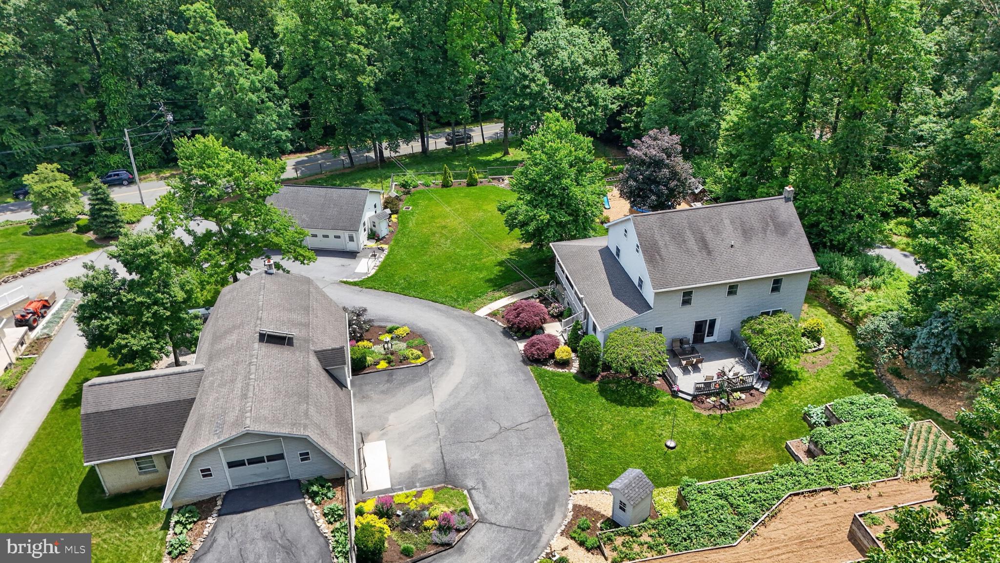 257 Hill Road New Holland, PA 17557 - Photo 7 of 94 Serene suburban retreat with lush greenery.