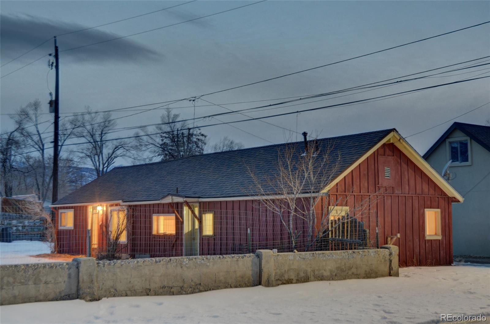 a view of a house and a wooden fence
