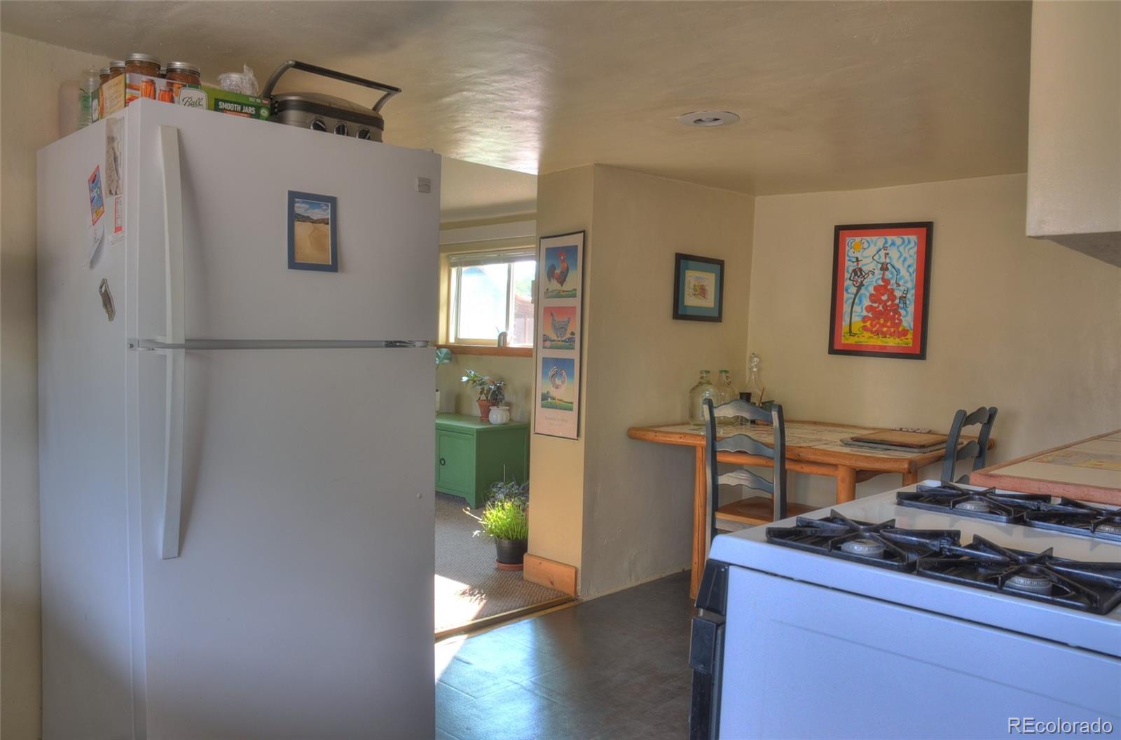 1406 G Street, Unit B Salida, CO 81201 - Photo 12 of 24 a kitchen with stainless steel appliances a refrigerator and a stove