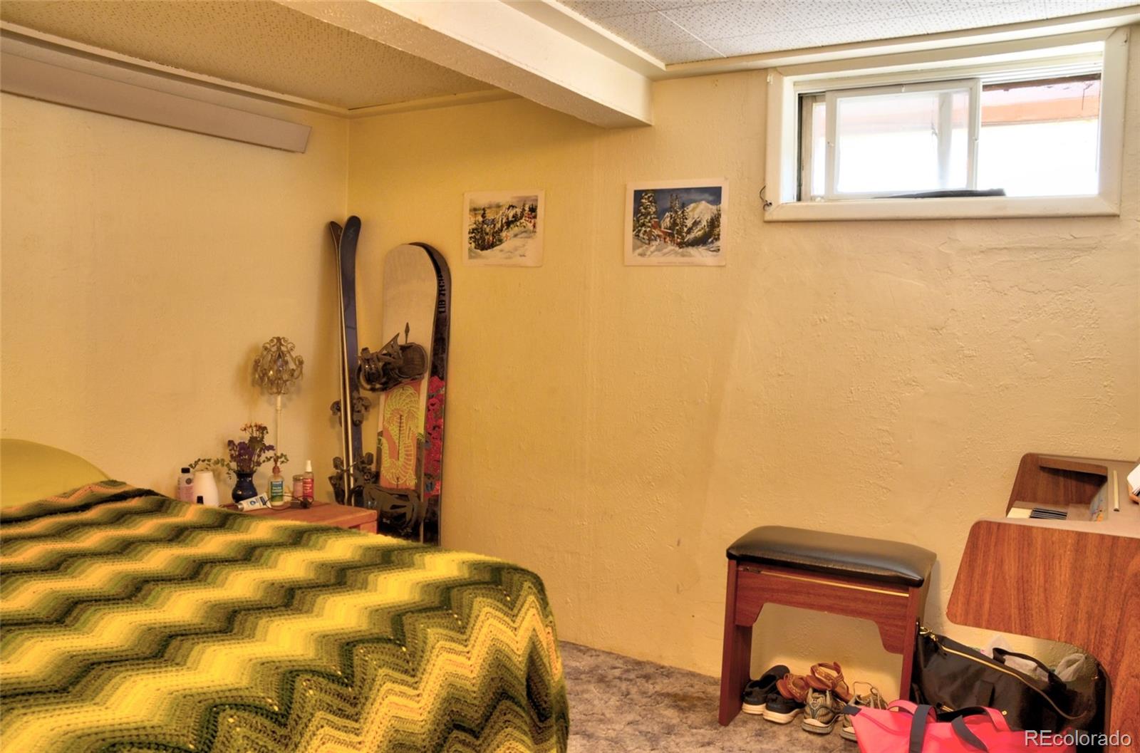 1406 G Street, Unit B Salida, CO 81201 - Photo 14 of 24 a bedroom with a bed and a window