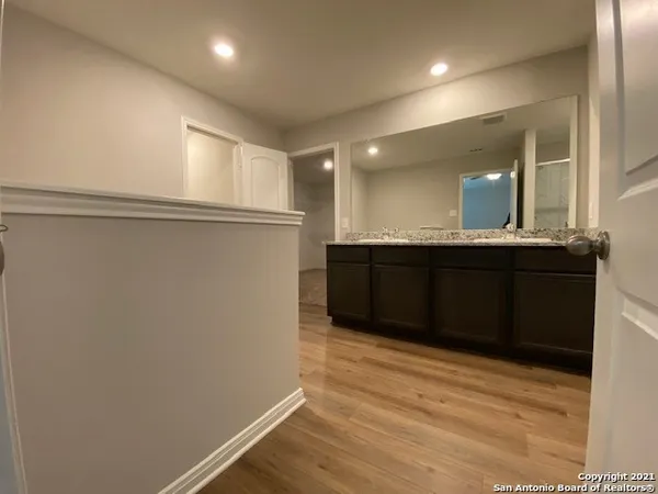a kitchen with a sink and wooden cabinets