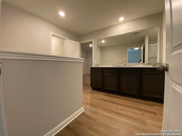 9310 Bennett Forest Converse, TX 78109 - Photo 11 of 24 a kitchen with a sink and wooden cabinets