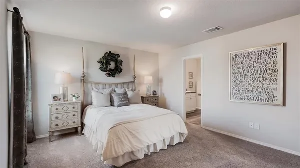 a bedroom with a bed and a cabinets