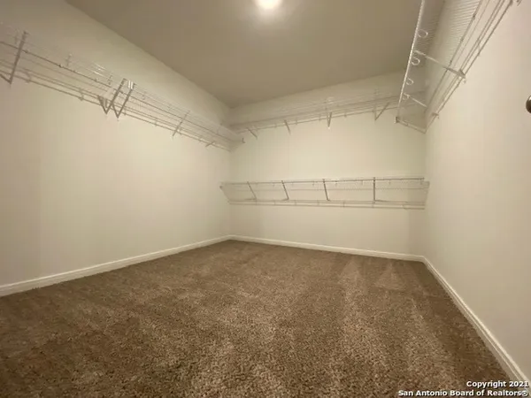 a view of a room with racks on the wall