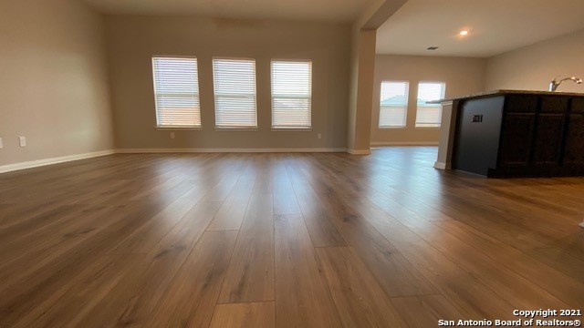 9310 Bennett Forest Converse, TX 78109 - Photo 5 of 24 a view of an empty room with wooden floor and a window
