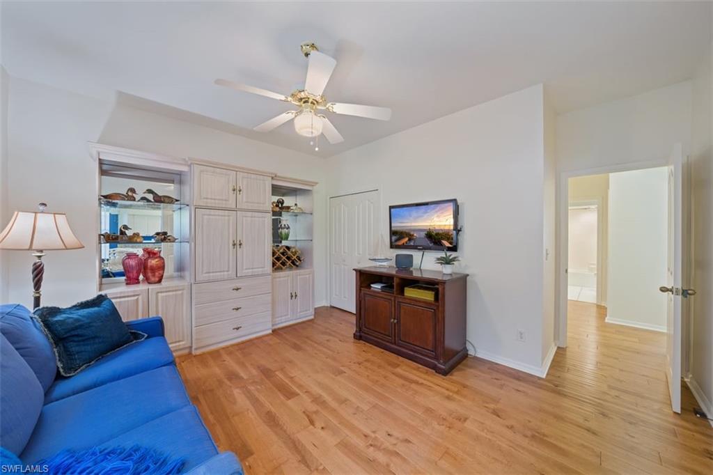 156 Napa Ridge Way Naples, FL 34119 - Photo 11 of 21 a living room with furniture and a flat screen tv