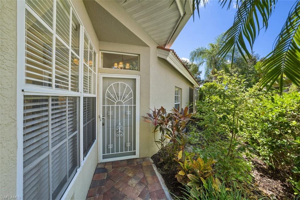 156 Napa Ridge Way Naples, FL 34119 - Photo 3 of 21 a backyard of a house
