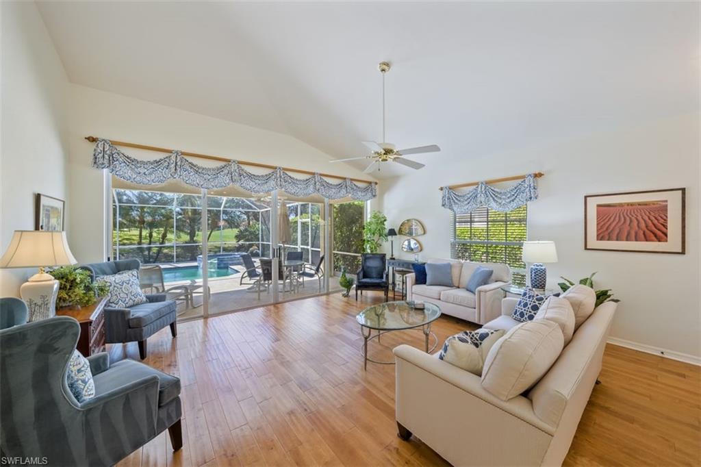 156 Napa Ridge Way Naples, FL 34119 - Photo 5 of 21 a living room with furniture and a large window