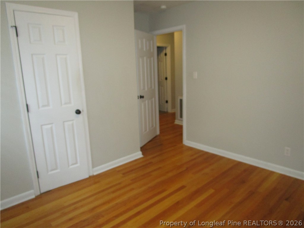 2516 Cumberland Road Fayetteville, NC 28306 - Photo 4 of 20 a view of a hallway with wooden floor