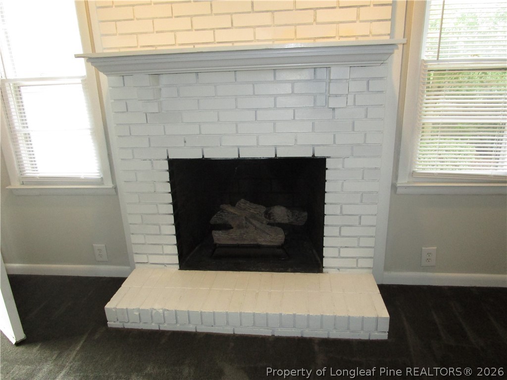 2516 Cumberland Road Fayetteville, NC 28306 - Photo 6 of 20 a room with a fireplace