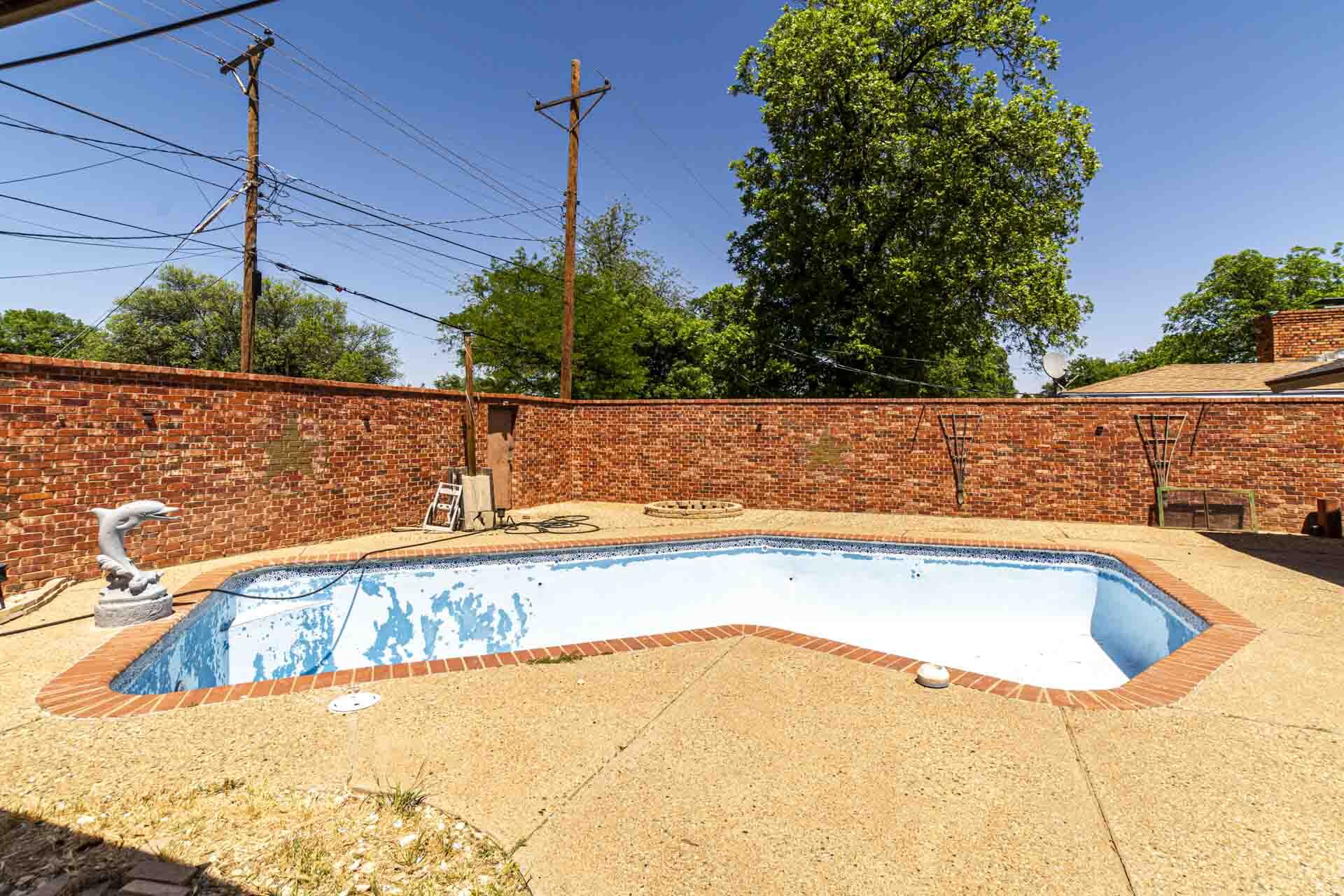 2136 57th Street Lubbock, TX 79412 - Photo 29 of 41 a view of a swimming pool with a yard