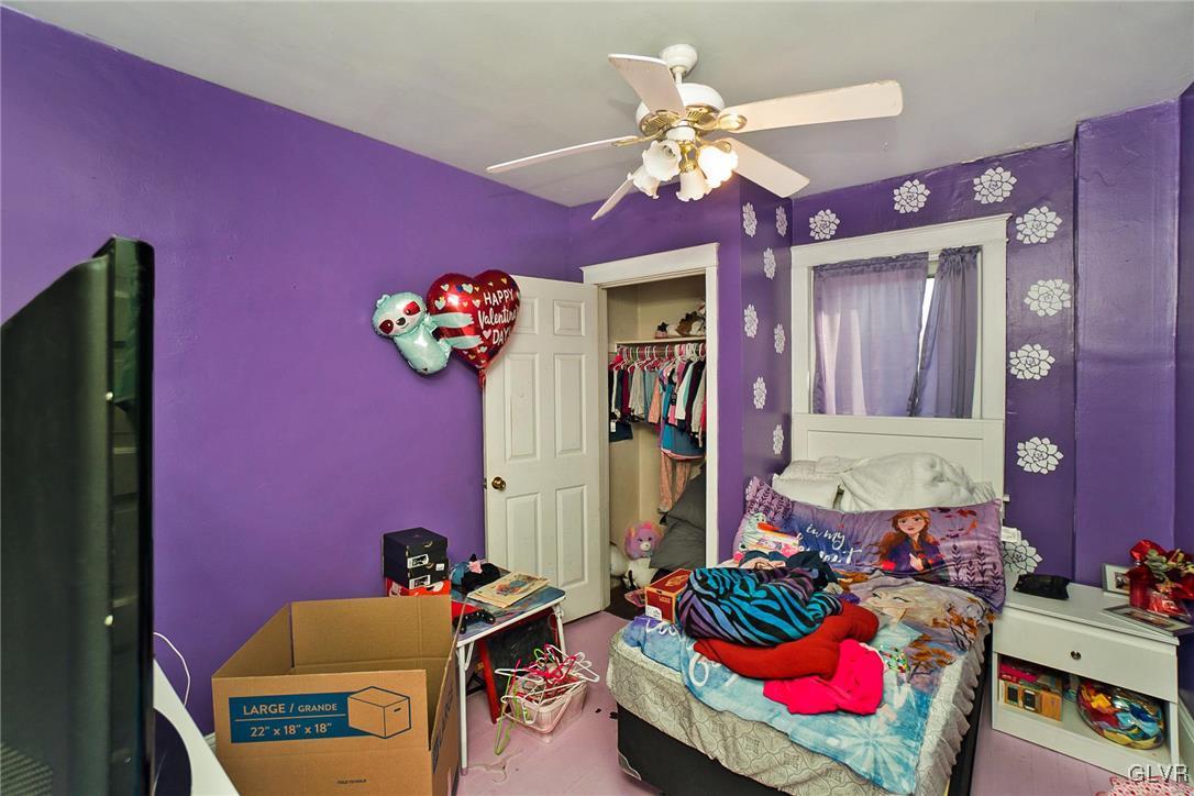 1017 Spring Street Bethlehem, PA 18018 - Photo 12 of 26 a bedroom with furniture and a chandelier
