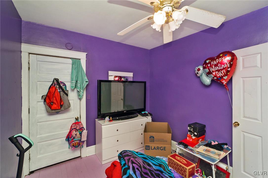 1017 Spring Street Bethlehem, PA 18018 - Photo 13 of 26 a bedroom with furniture and a flat screen tv