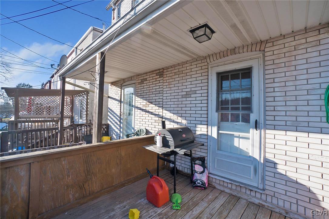 1017 Spring Street Bethlehem, PA 18018 - Photo 19 of 26 a balcony with wooden floor and furniture