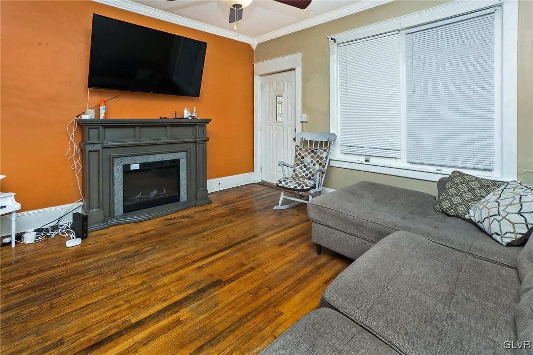 1017 Spring Street Bethlehem, PA 18018 - Photo 2 of 26 a living room with furniture fireplace and flat screen tv
