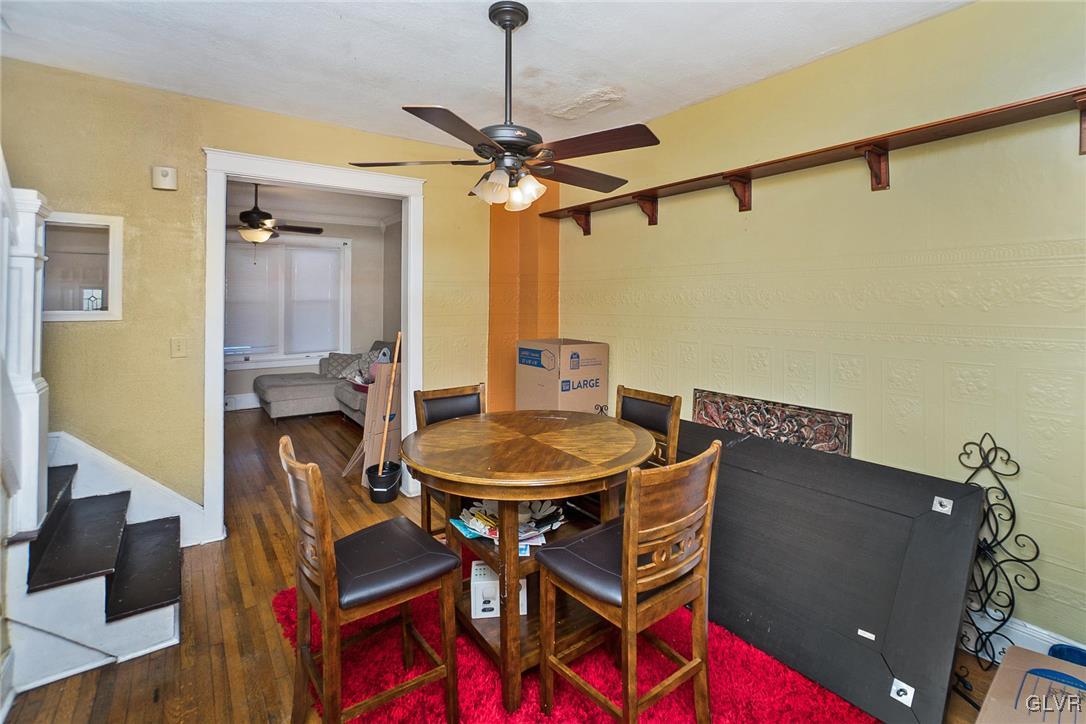 1017 Spring Street Bethlehem, PA 18018 - Photo 6 of 26 a dining room with furniture and a chandelier fan