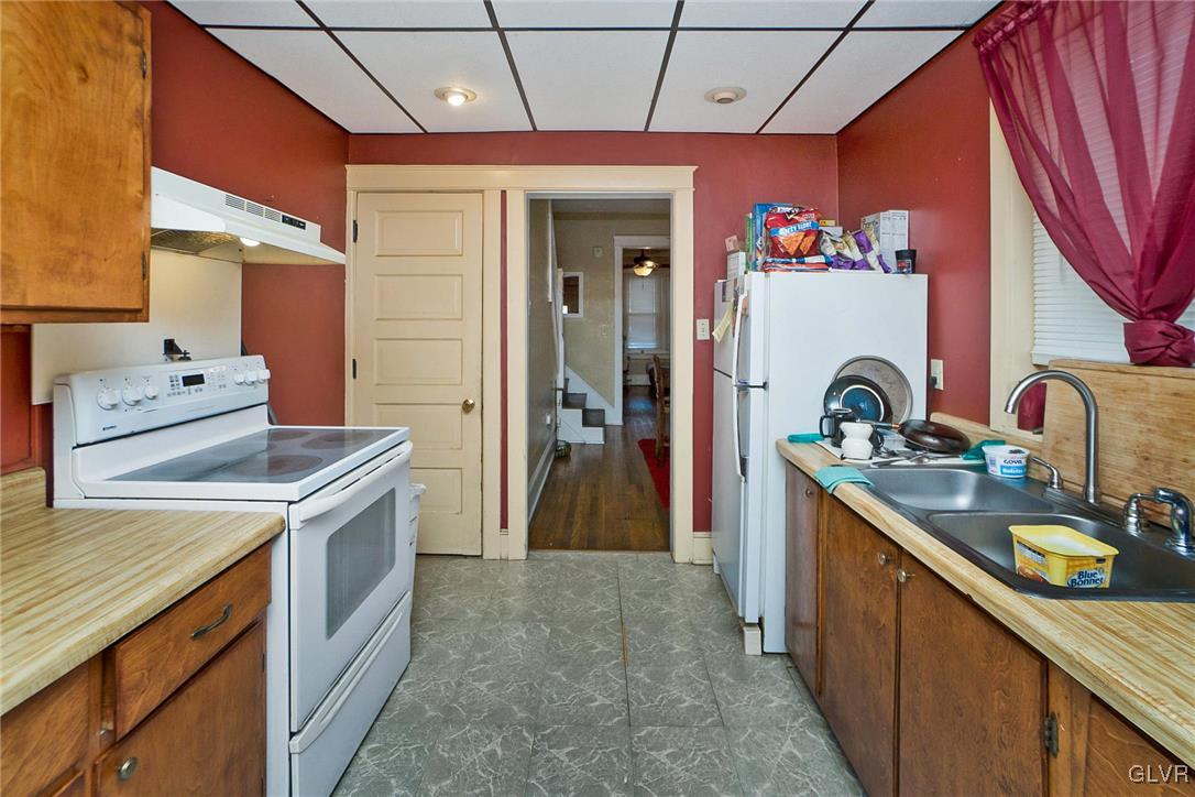 1017 Spring Street Bethlehem, PA 18018 - Photo 9 of 26 a kitchen that has a lot of cabinets in it